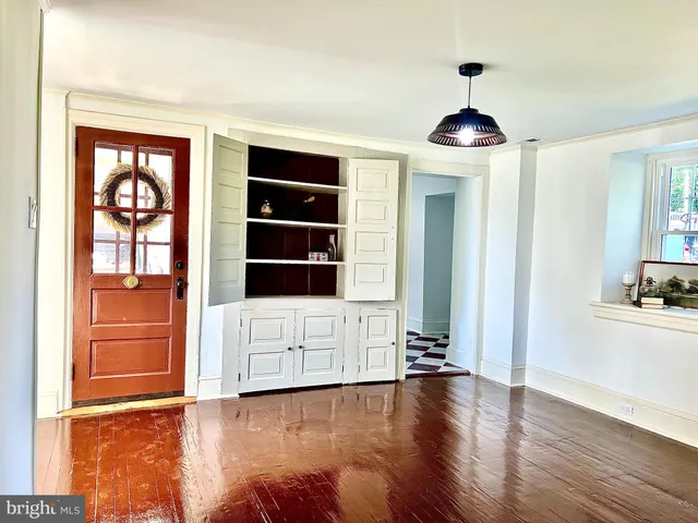 a view of a porch with wooden floor