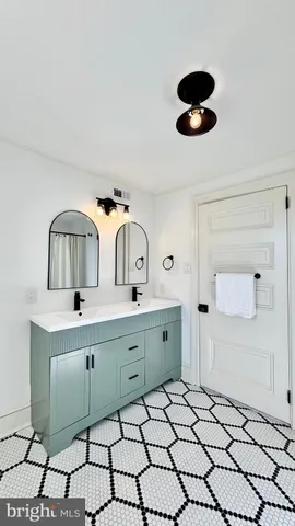 an empty room with windows and fireplace