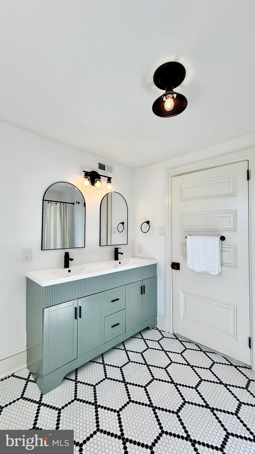 2437 Patane Avenue Abington, PA 19001 - Photo 32 of 69 a bathroom with a sink and a mirror