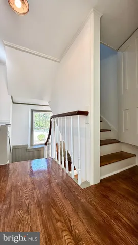 an empty room with wooden floor