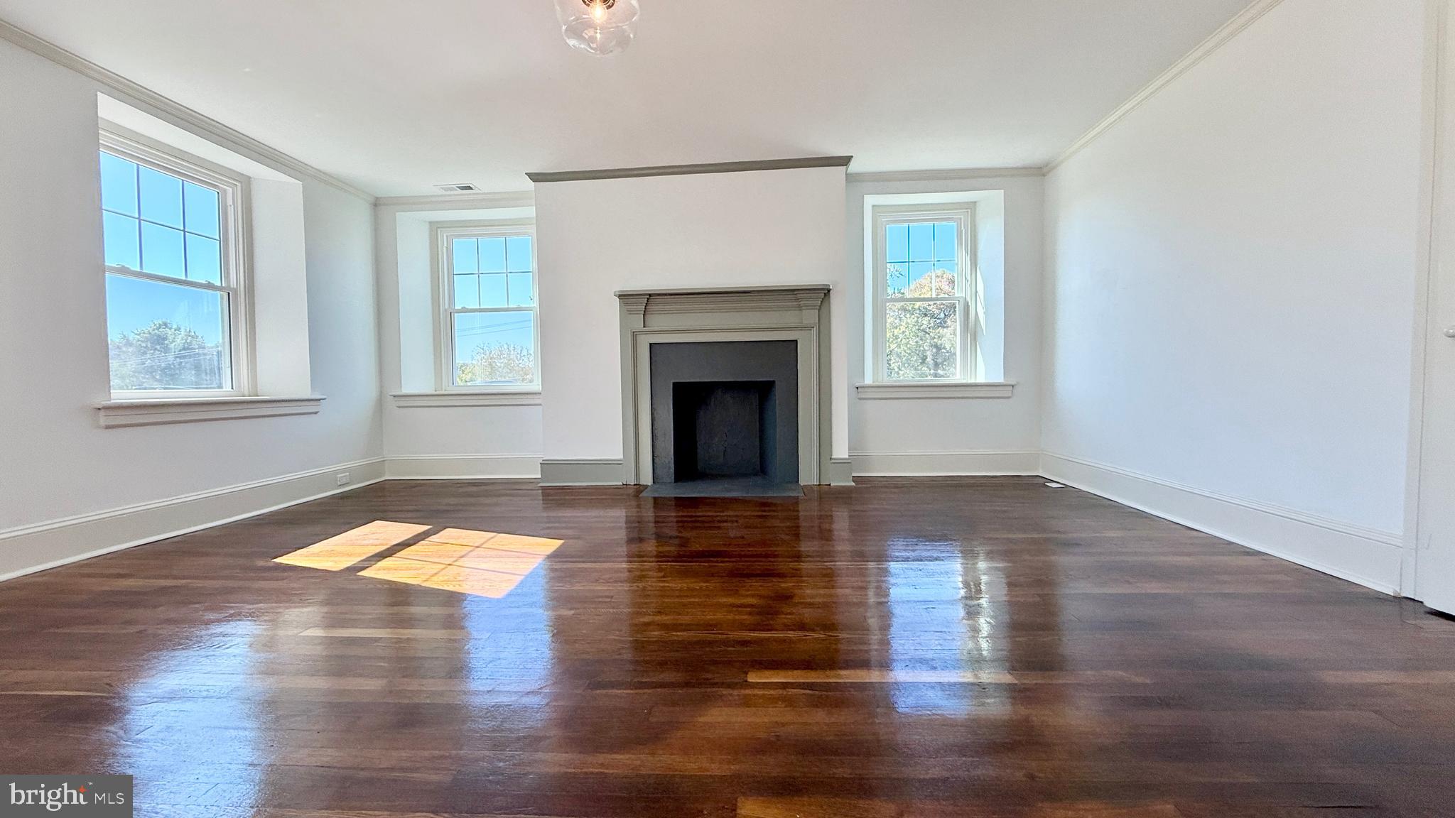 2437 Patane Avenue Abington, PA 19001 - Photo 37 of 69 a view of a livingroom with wooden floor a fireplace and windows