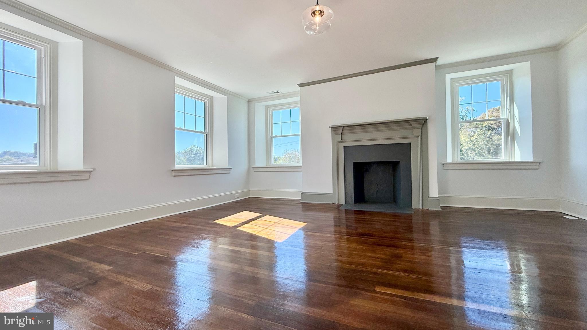 2437 Patane Avenue Abington, PA 19001 - Photo 38 of 69 a view of empty room with wooden floor and fireplace