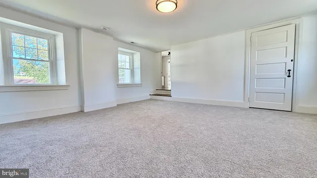 a picture of a floor to ceiling window and carpet