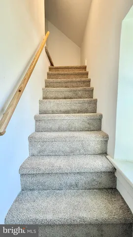 a view of a house with swimming pool and sitting area