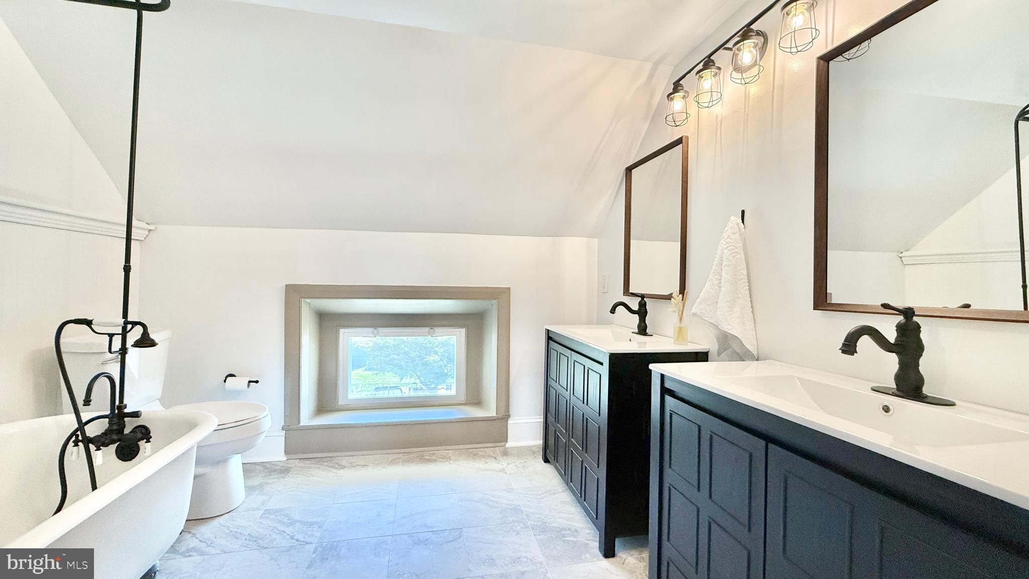 2437 Patane Avenue Abington, PA 19001 - Photo 59 of 69 a bathroom with a sink a window and a mirror