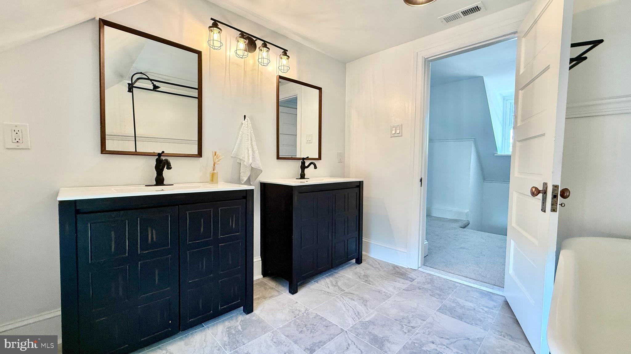 2437 Patane Avenue Abington, PA 19001 - Photo 63 of 69 a bathroom with a sink and a mirror