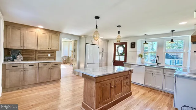 a kitchen with a window a sink and a window