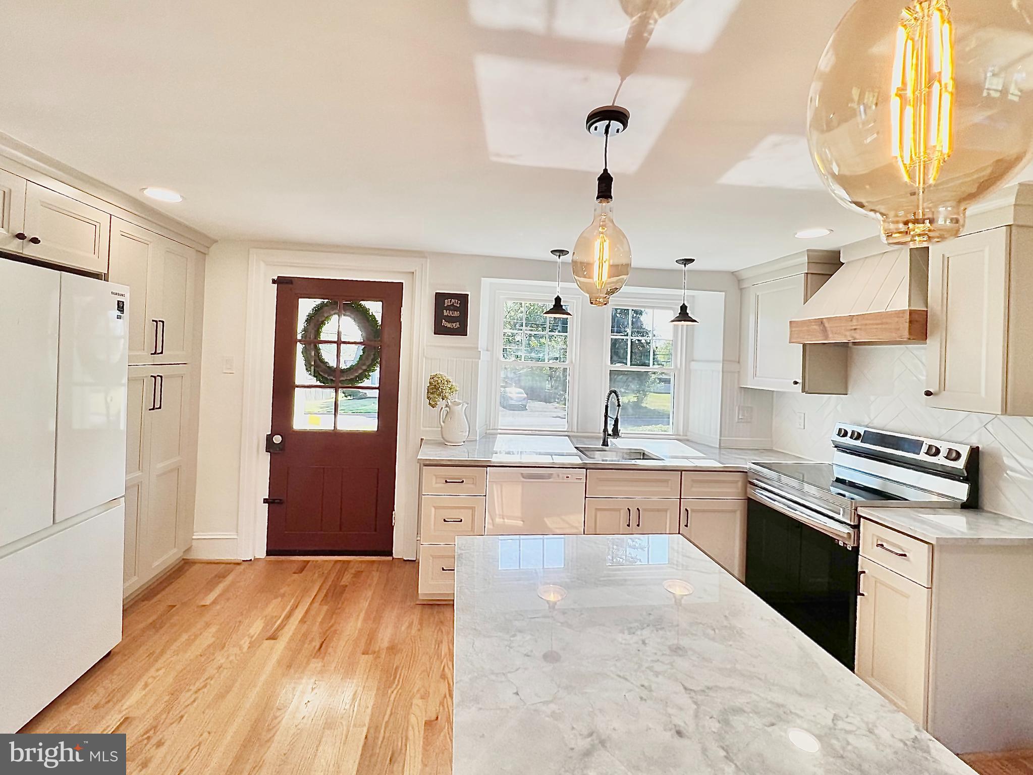 2437 Patane Avenue Abington, PA 19001 - Photo 10 of 69 a large kitchen with stainless steel appliances granite countertop a stove refrigerator and cabinets