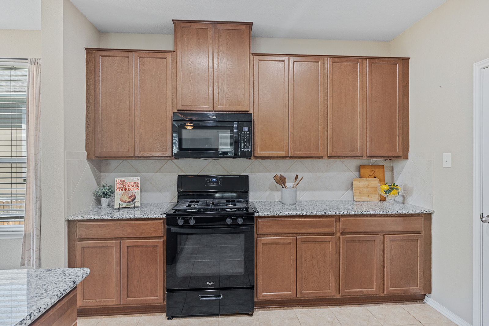 437 Sheepshank Drive Georgetown, TX 78633 - Photo 6 of 22 Well-appointed kitchen featuring abundant cabinetry, more granite countertops, and modern appliances.