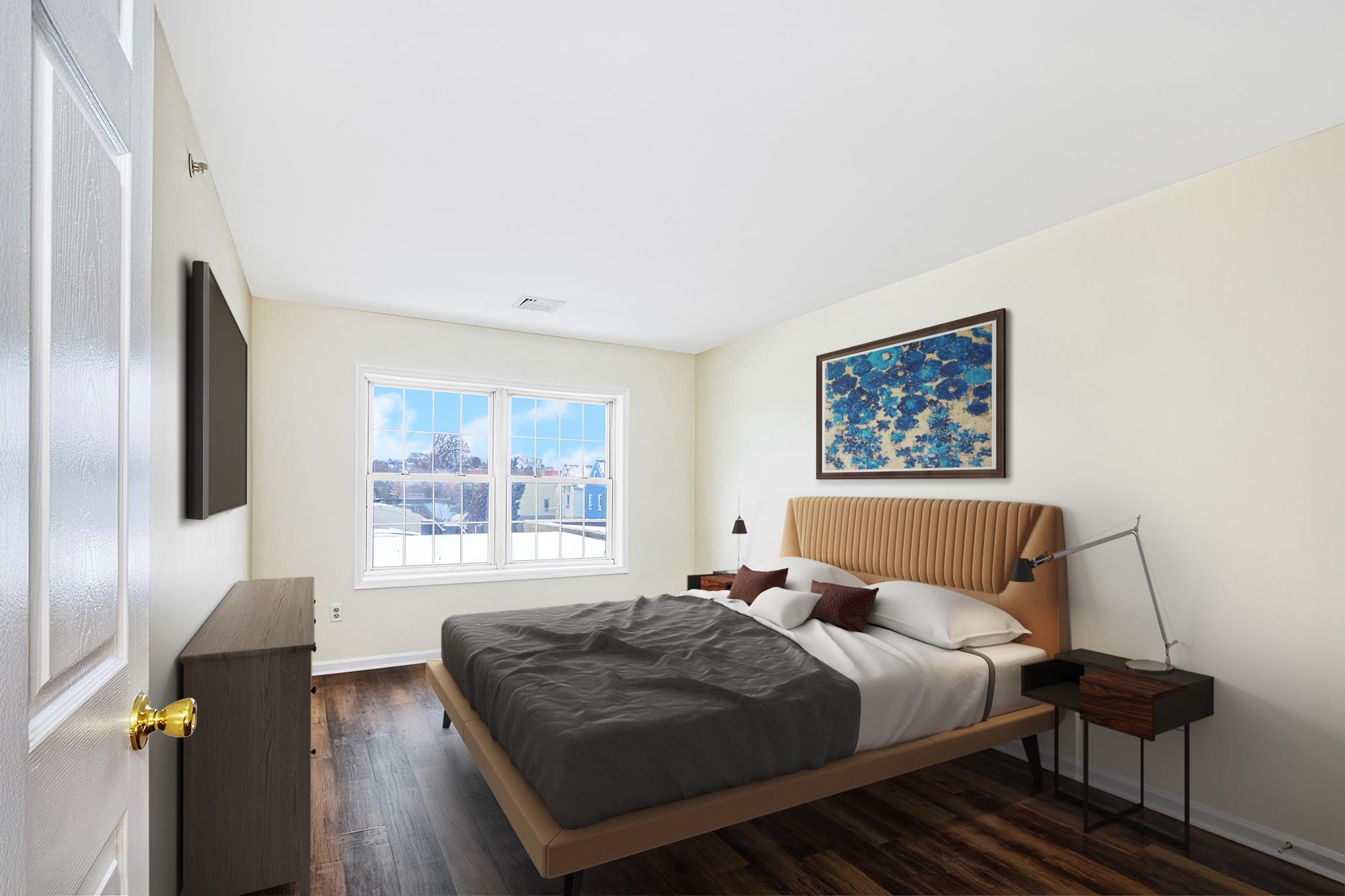 9 Madison Avenue, Unit 18 Paterson, NJ 07524 - Photo 6 of 18 a bedroom with a bed and wooden floor