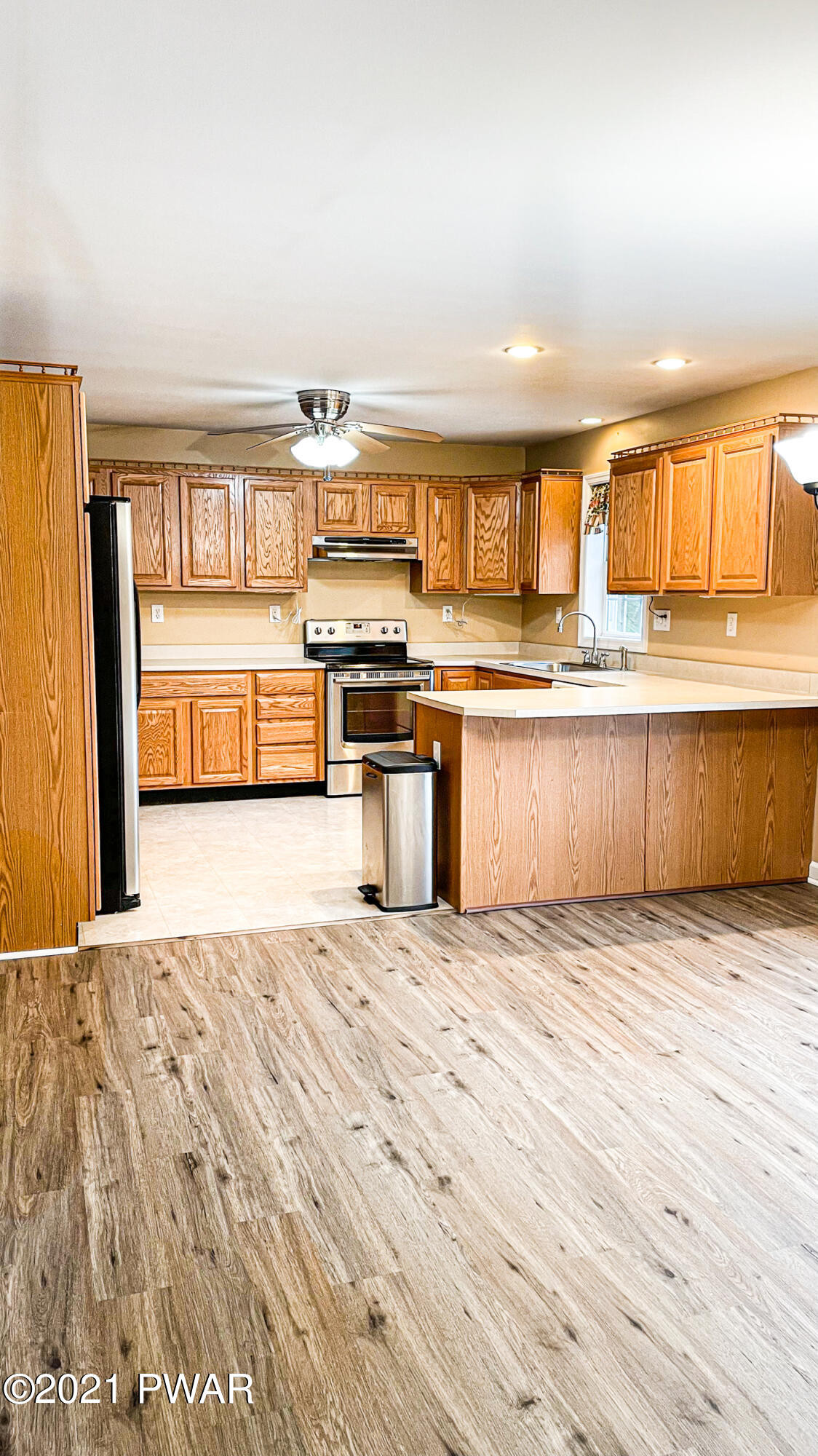 159 Fox Road Dingmans Ferry, PA 18328 - Photo 14 of 80 a kitchen with granite countertop a stove top oven and sink