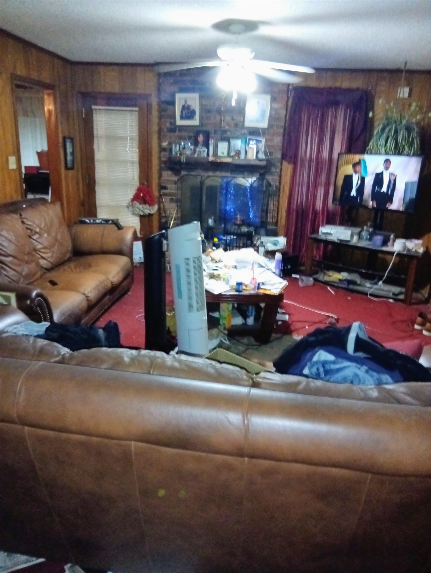 4876 Cottonwood Road Memphis, TN 38118 - Photo 5 of 6 a living room with furniture and a fireplace