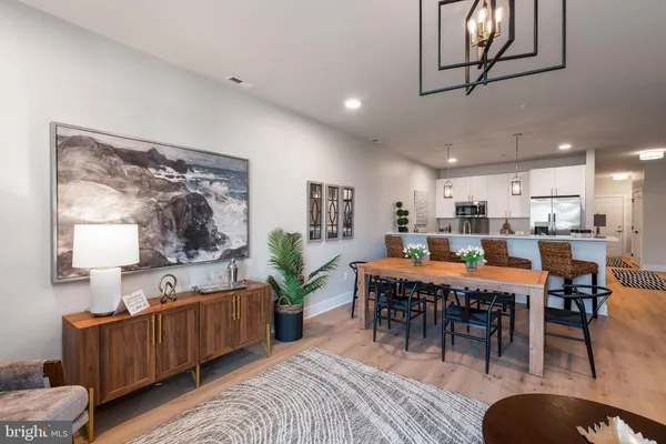 a kitchen with a sink a stove and cabinets