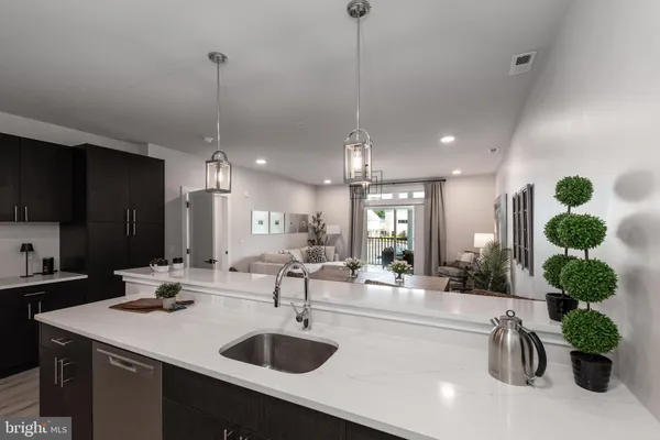 a kitchen with a refrigerator and a sink
