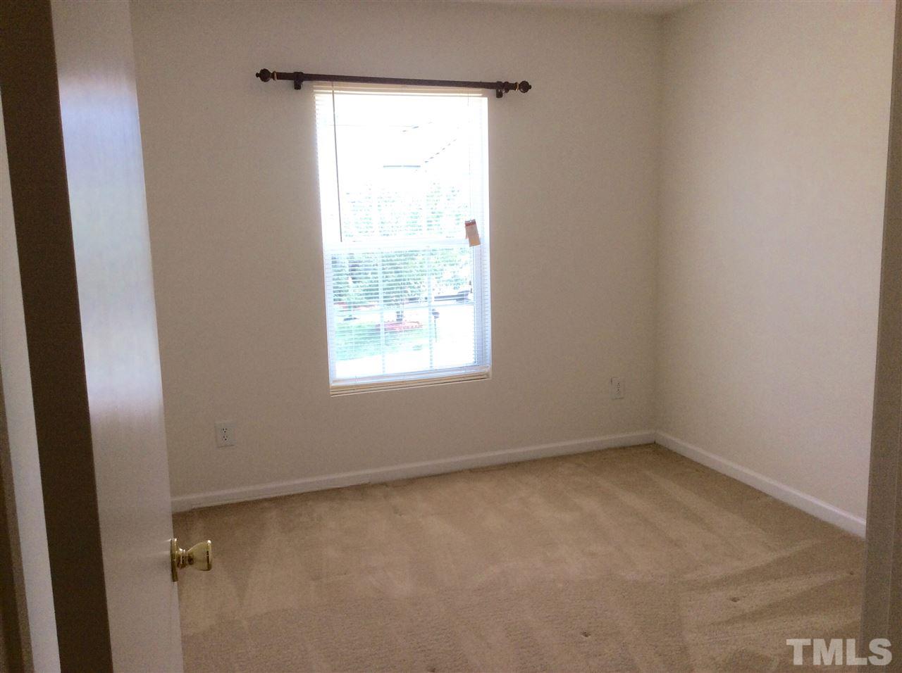 3729 Marshlane Way Raleigh, NC 27610 - Photo 11 of 16 an empty room with a window