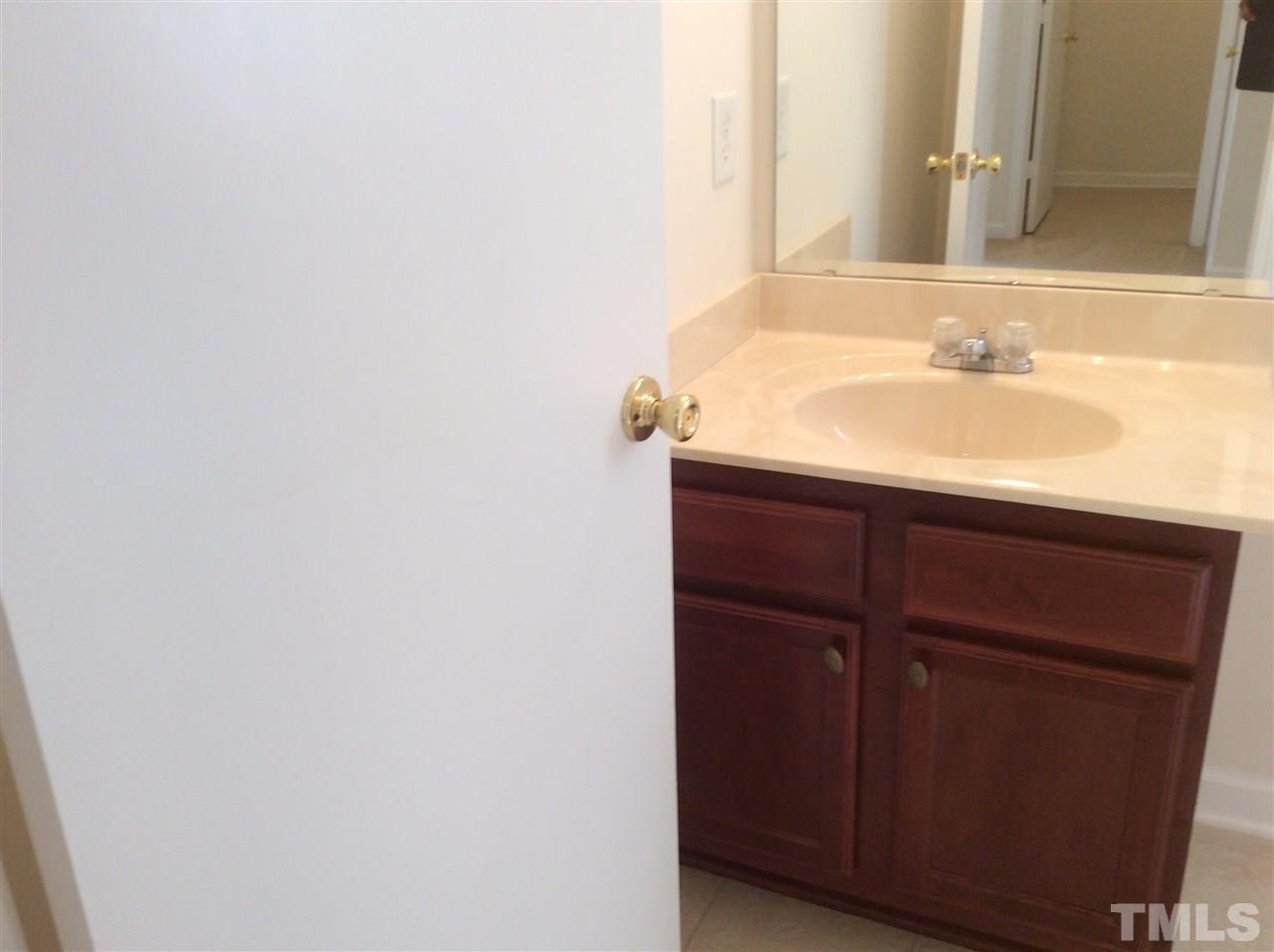 3729 Marshlane Way Raleigh, NC 27610 - Photo 12 of 16 a bathroom with a sink and a mirror