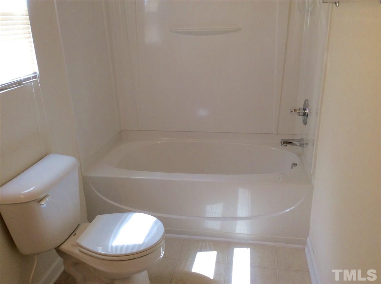 3729 Marshlane Way Raleigh, NC 27610 - Photo 13 of 16 a bathroom with a toilet and a bathtub