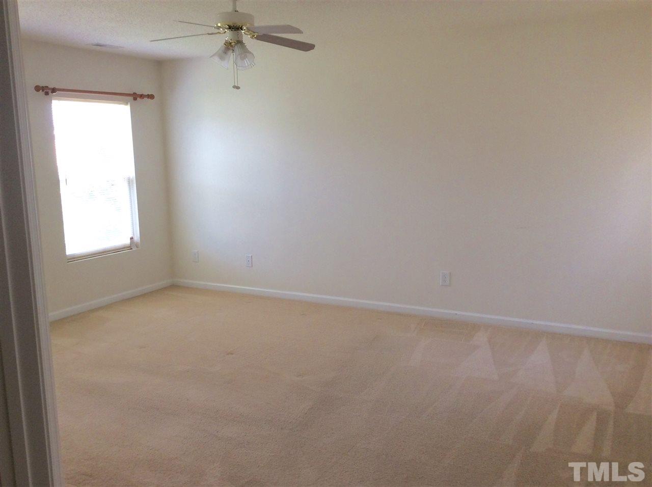 3729 Marshlane Way Raleigh, NC 27610 - Photo 14 of 16 an empty room with a window