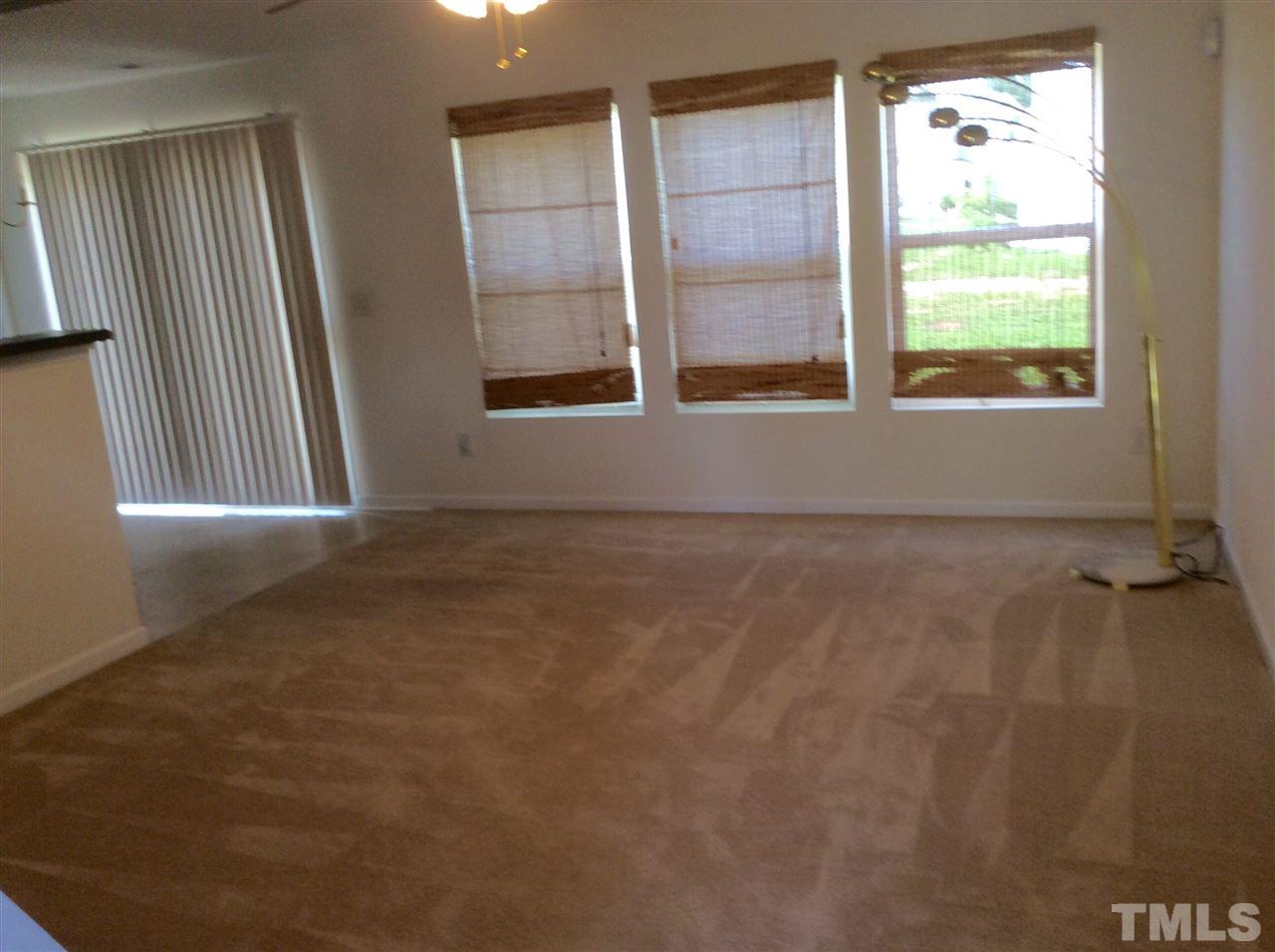 3729 Marshlane Way Raleigh, NC 27610 - Photo 3 of 16 an empty room with windows