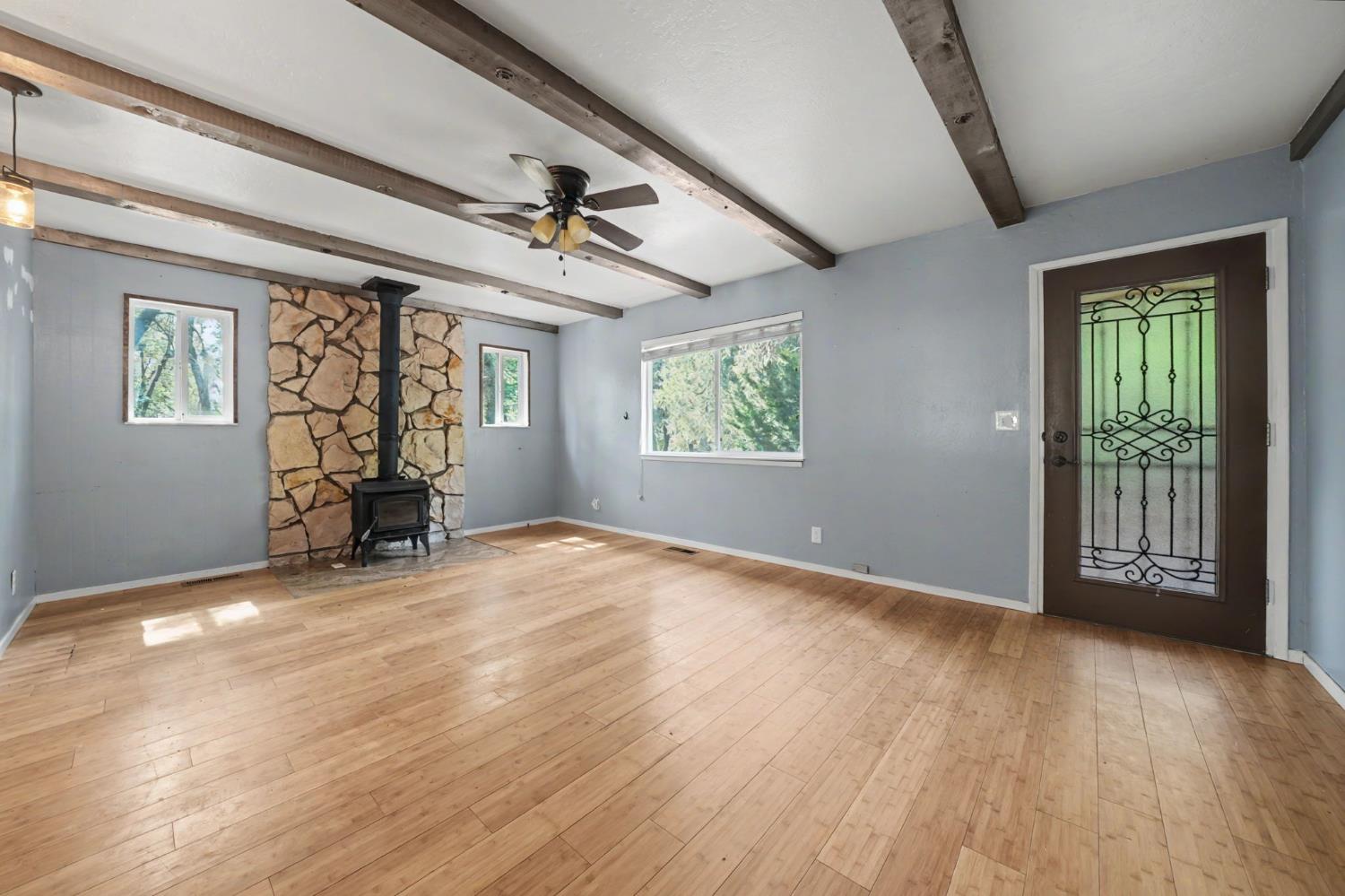 19479 Murphy Road Pine Grove, CA 95665 - Photo 18 of 43 a view of an empty room with a window and wooden floor