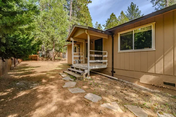 a view of a backyard of the house