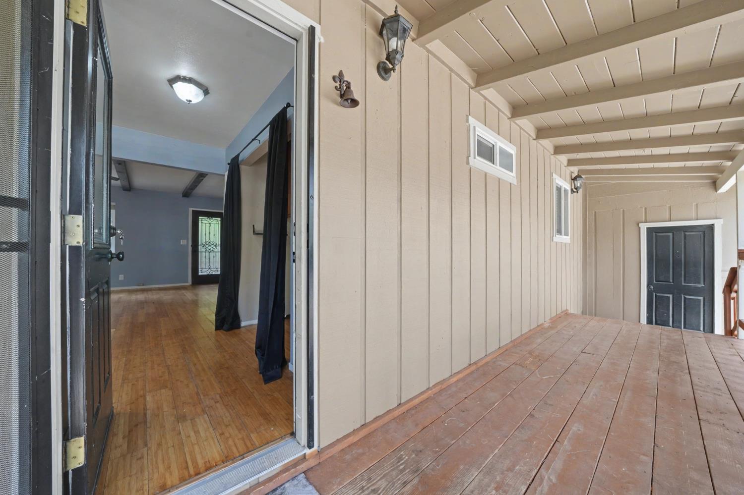 19479 Murphy Road Pine Grove, CA 95665 - Photo 4 of 43 a view of a hallway with wooden floor and staircase