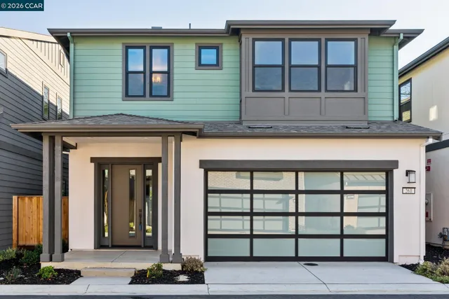 a front view of a house with a glass windows