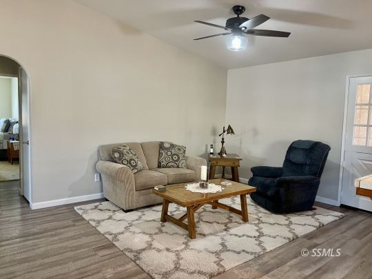 205 Chambers Street Ridgecrest, CA 93555 - Photo 7 of 32 a living room with furniture and a ceiling fan