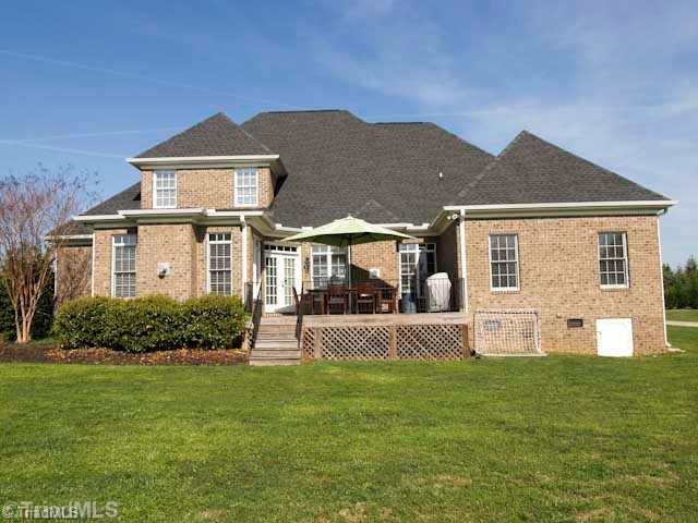 5700 Cape Fox Drive Oak Ridge, NC 27310 - Photo 15 of 16 Exterior Back.