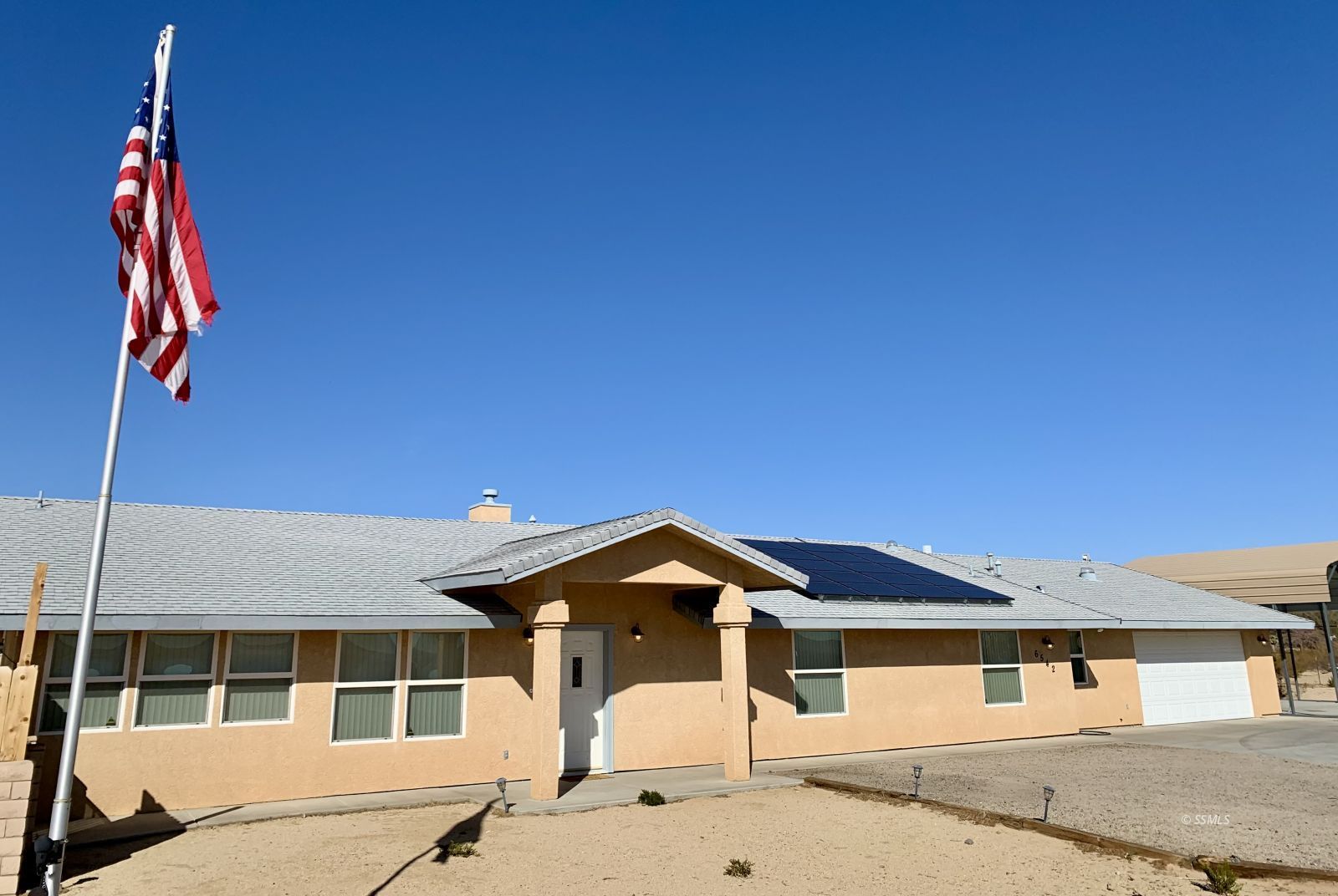 6542 Ridgecrest Boulevard Inyokern, CA 93527 - Photo 4 of 50 a front view of a house with a yard