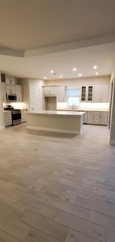 a bathroom with a sink and a large mirror