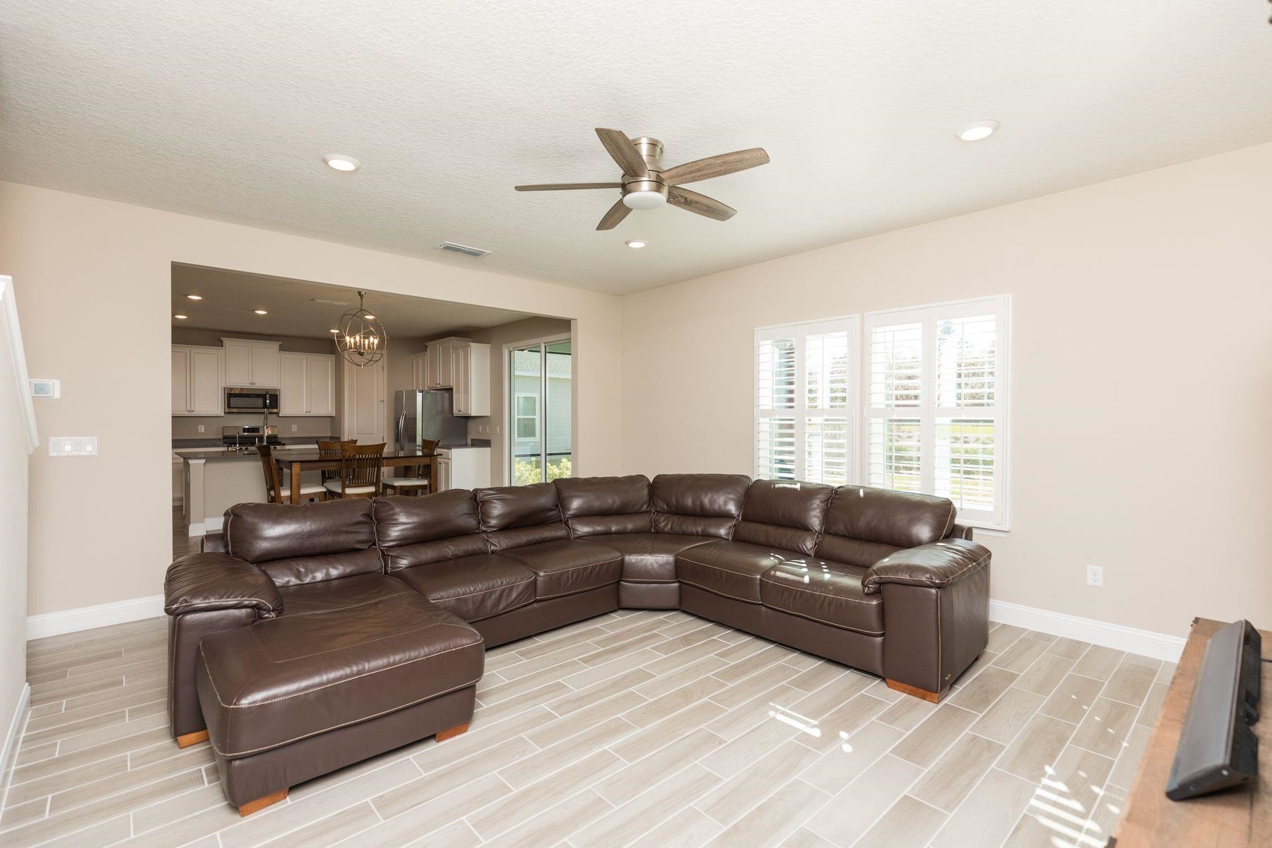 91 Ridgewind Drive St. Augustine, FL 32092 - Photo 11 of 49 a living room with furniture window and a view of kitchen