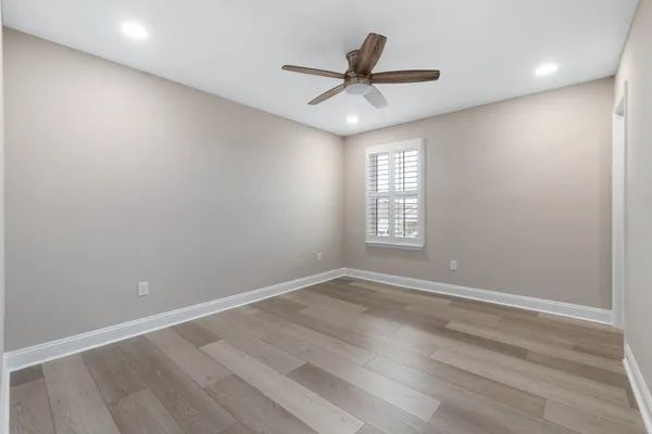 a view of a room with wooden floor and balcony