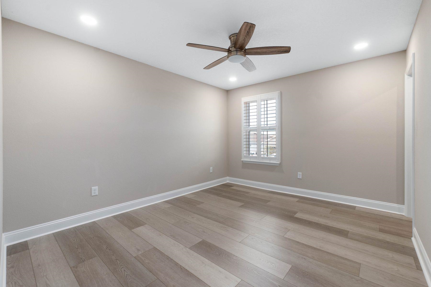 91 Ridgewind Drive St. Augustine, FL 32092 - Photo 26 of 49 wooden floor in an empty room with a window