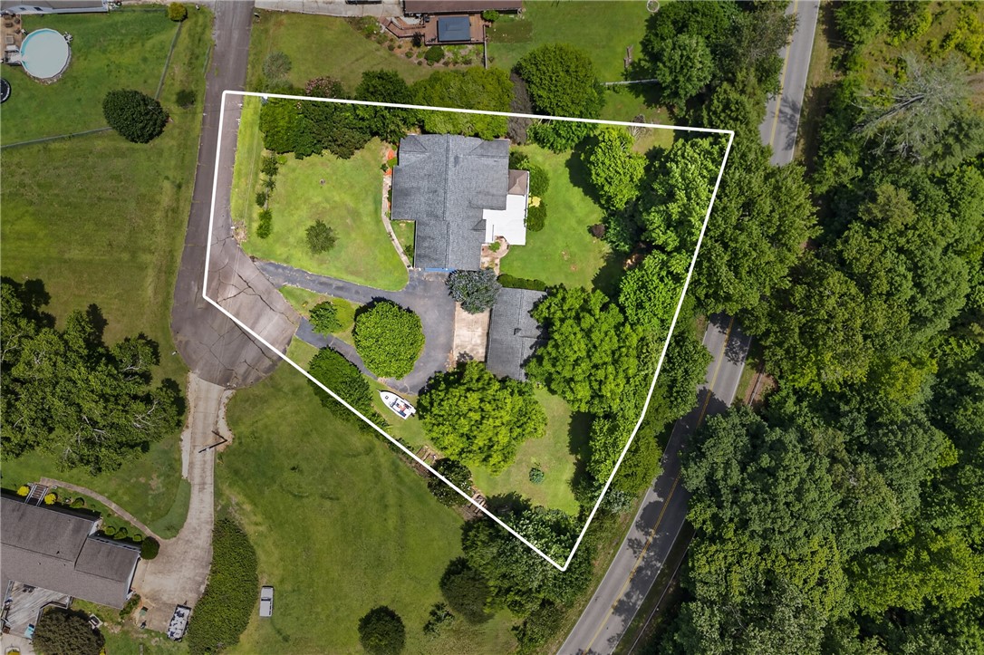103 Dorsey Lane Walhalla, SC 29691 - Photo 2 of 42 An aerial view showcases a generously proportioned lot, dotted with established trees and a sweeping driveway leading to the main residence.