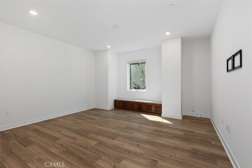 4200 Rivington Irvine, CA 92612 - Photo 10 of 11 an empty room with wooden floor and window