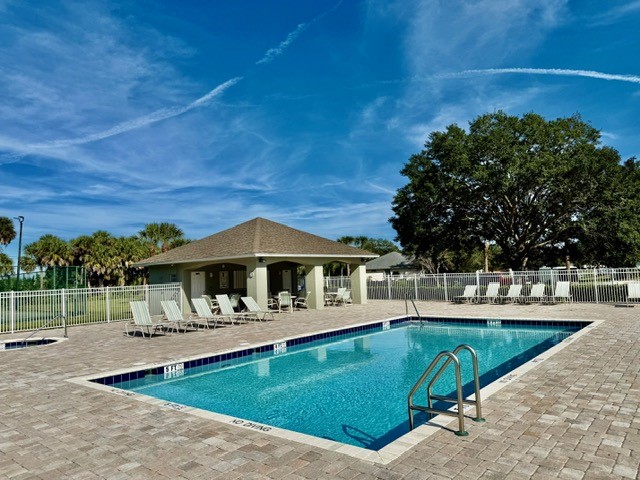 5475 East 1st Square Southwest Vero Beach, FL 32968 - Photo 18 of 19 a view of a swimming pool with a patio