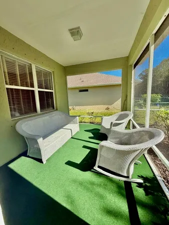 a view of a kitchen with a sink and refrigerator