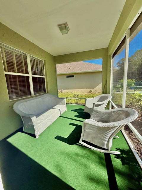 5475 East 1st Square Southwest Vero Beach, FL 32968 - Photo 5 of 19 a front view of a house with porch and a garden