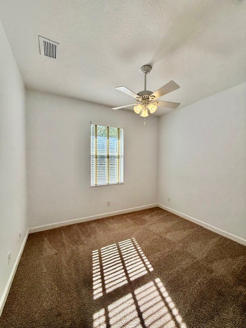 5475 East 1st Square Southwest Vero Beach, FL 32968 - Photo 9 of 19 wooden floor in an empty room with a window