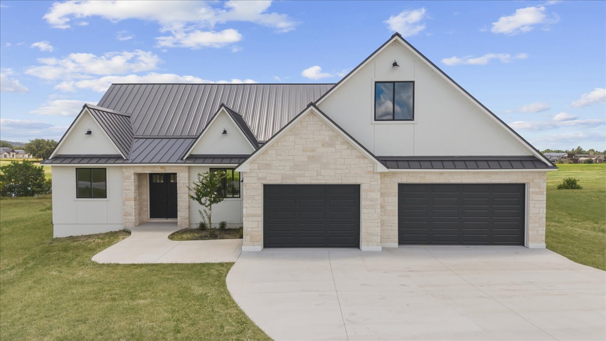 224 Sandia Loop Kingsland, TX 78639 - Photo 2 of 32 a front view of house with garage