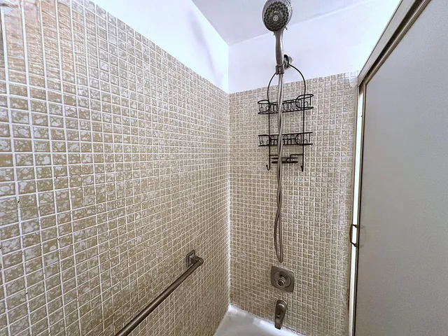 an aerial view of residential houses with outdoor space and river