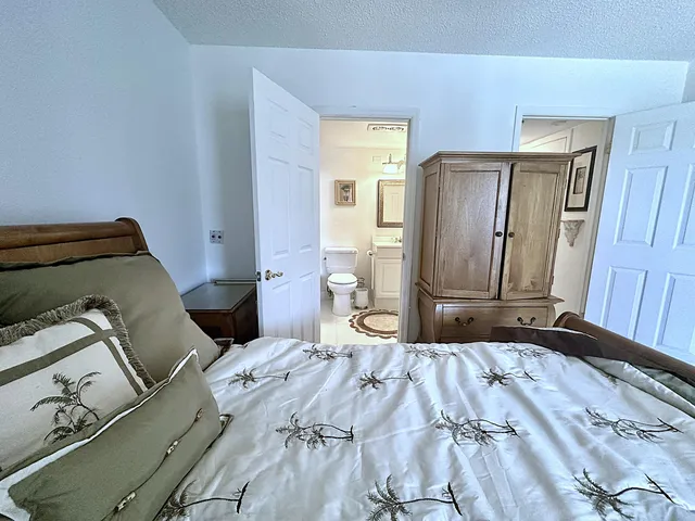 a living room with furniture a wooden floor and next to a window