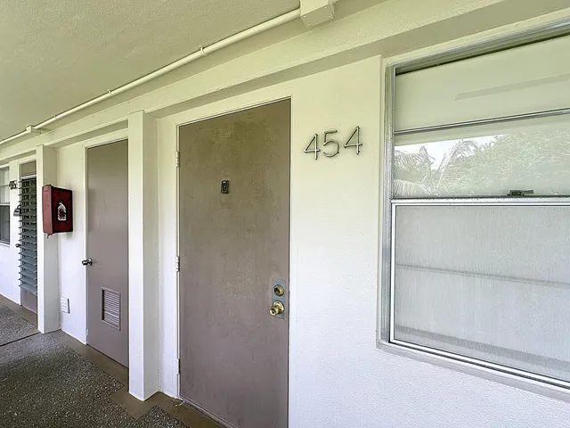 a view of a park with swings and slides