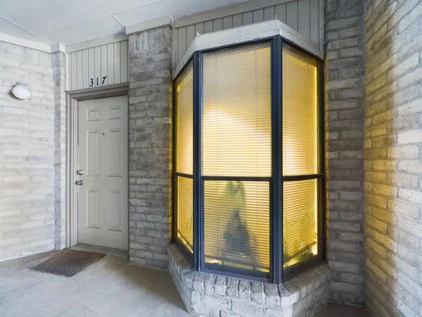 a view of a bathroom with a glass door