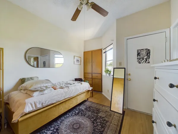 a bedroom with a bed and a dresser