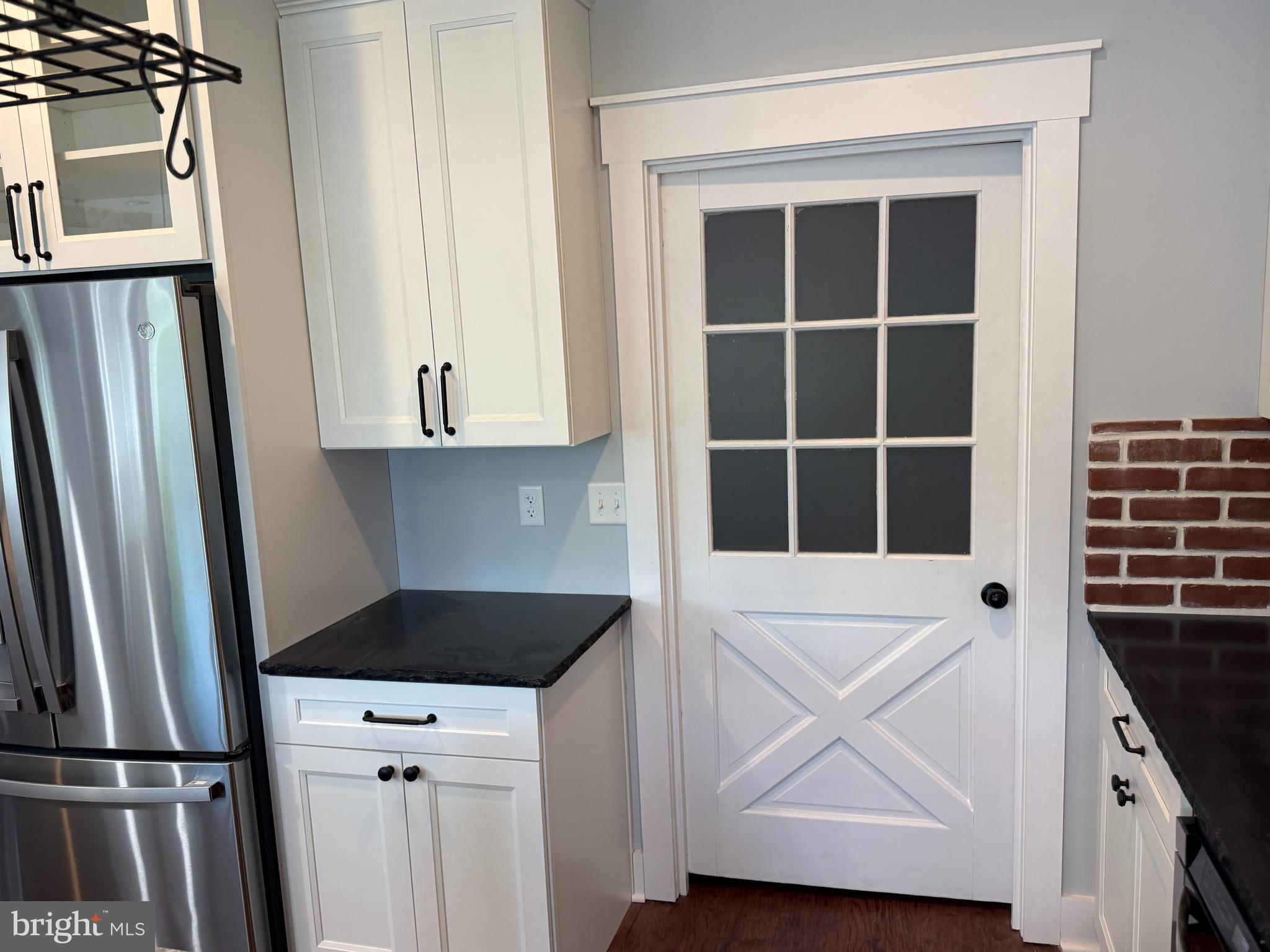 5482 Summit Bridge Road Townsend, DE 19734 - Photo 21 of 43 a kitchen with a refrigerator and a sink