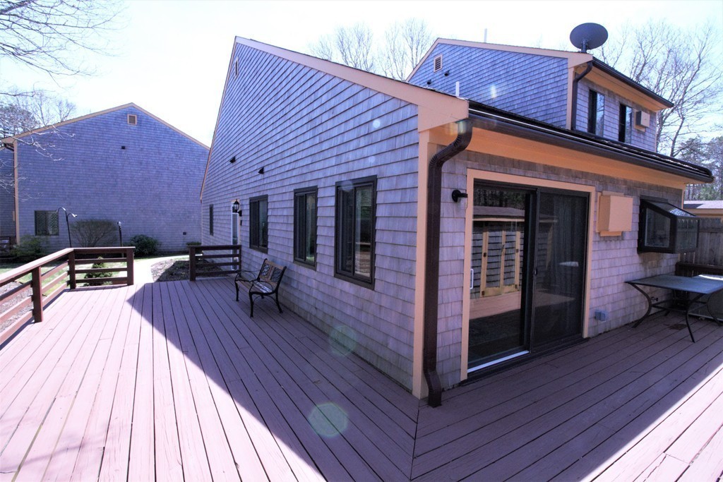 27 Round House Road, Unit 27 Bourne, MA 02532 - Photo 12 of 13 a view of a house with pool table chairs and wooden floor