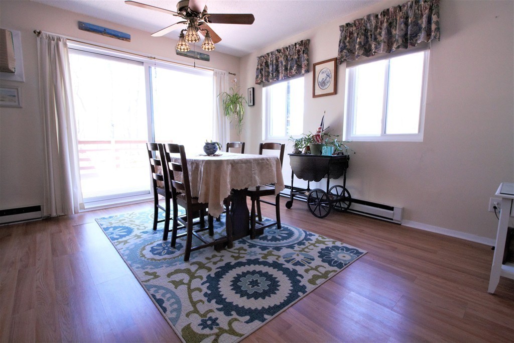 27 Round House Road, Unit 27 Bourne, MA 02532 - Photo 5 of 13 a view of a dining room with furniture window and wooden floor
