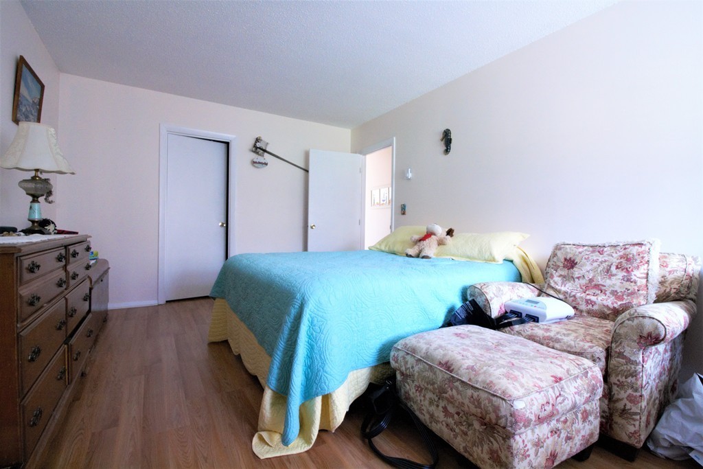 27 Round House Road, Unit 27 Bourne, MA 02532 - Photo 9 of 13 a bedroom with two beds and a dresser